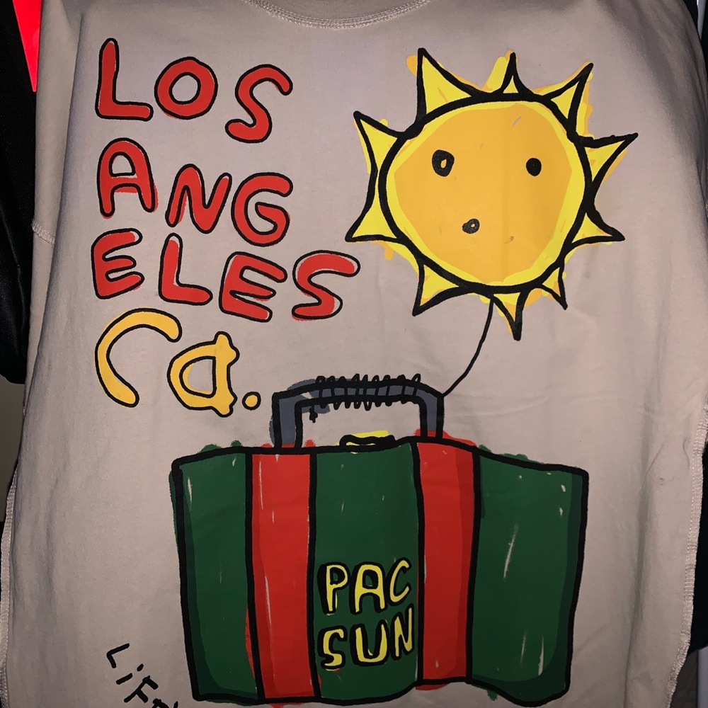 PacSun Graphic Tee with Sun and Suitcase Design